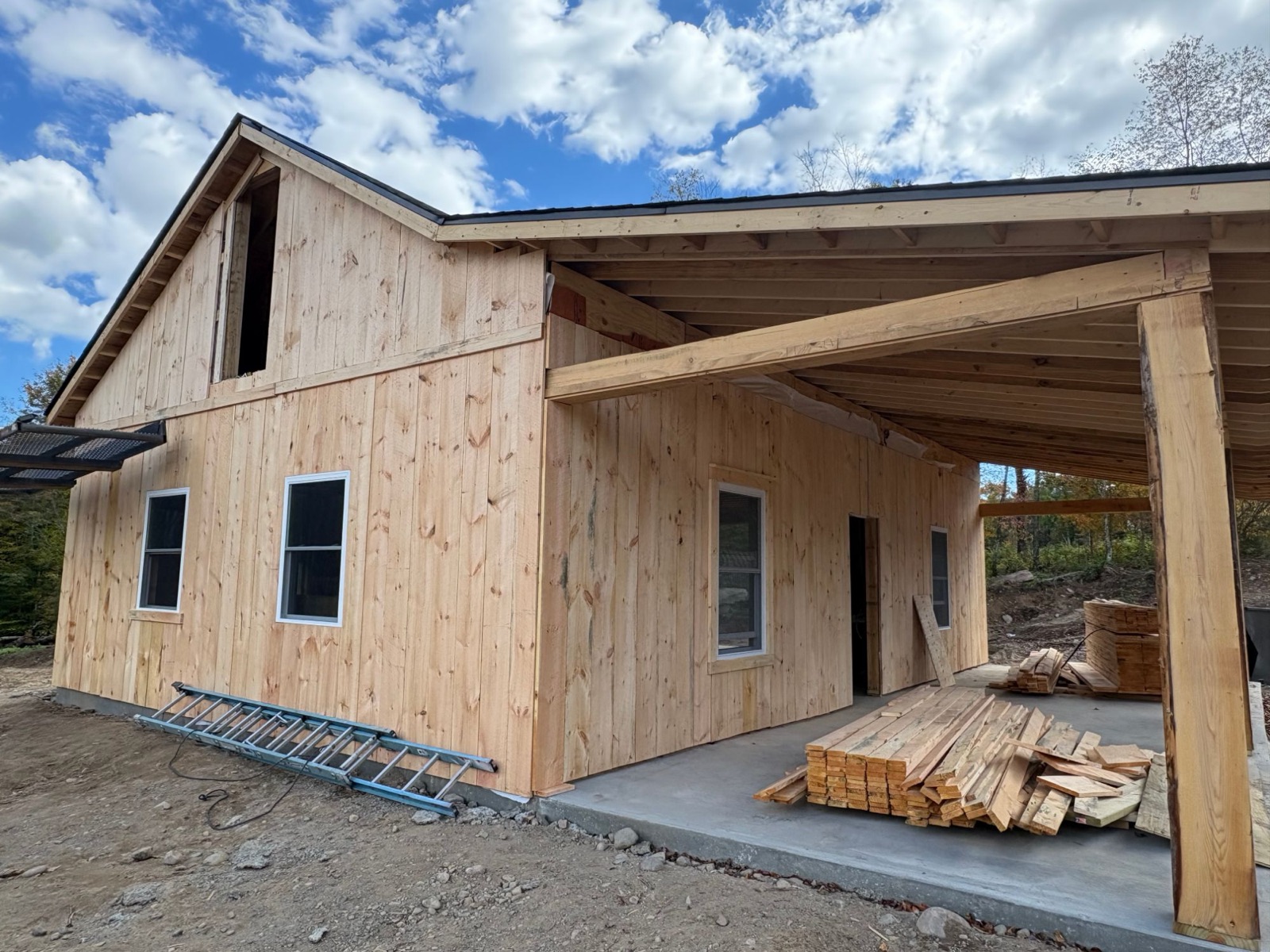 Side view of the new Christmas tree shop with fresh pine board siding