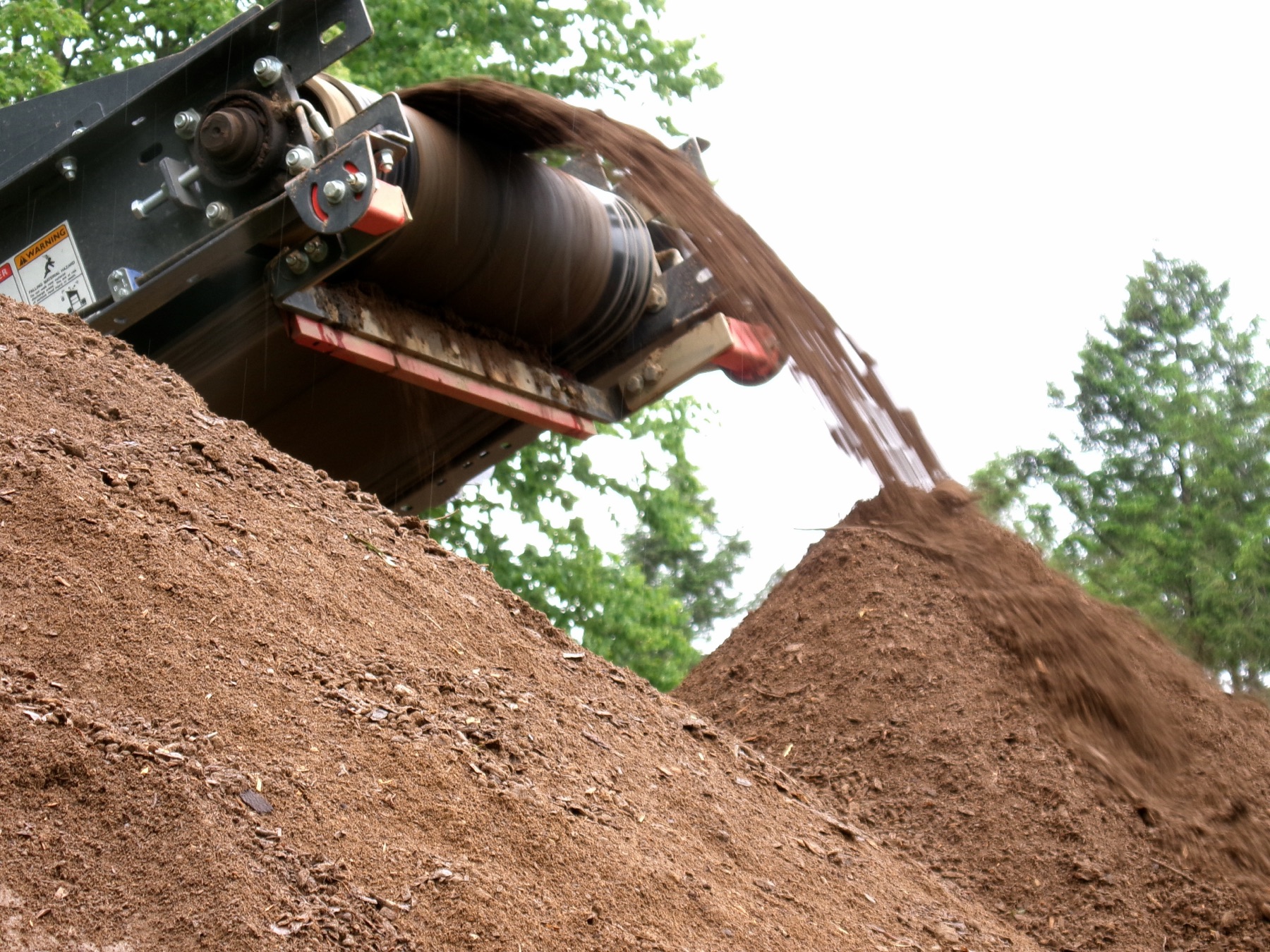 Screened topsoil coming off the conveyor